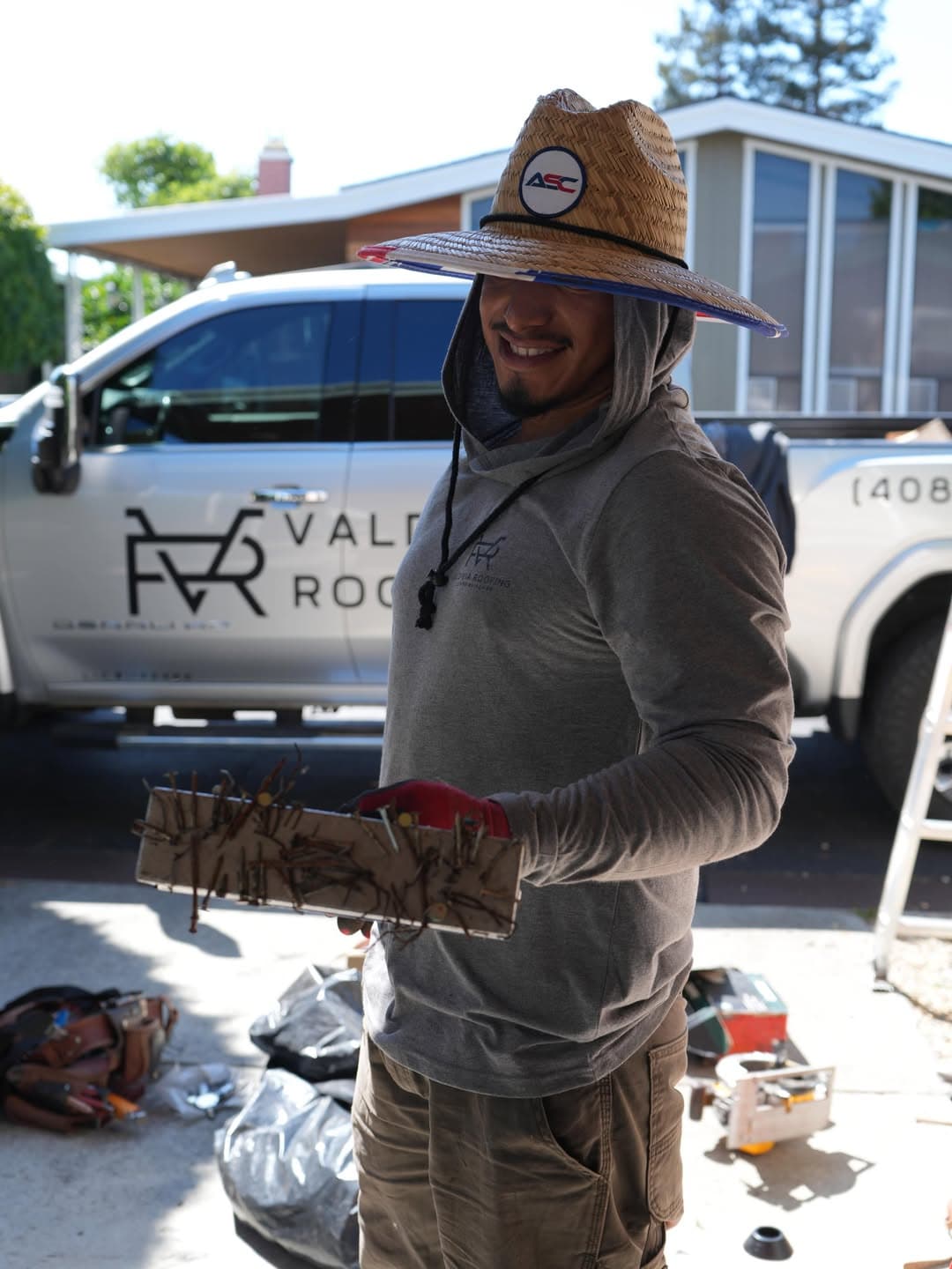 Valdivia Roofing crew member on a roof