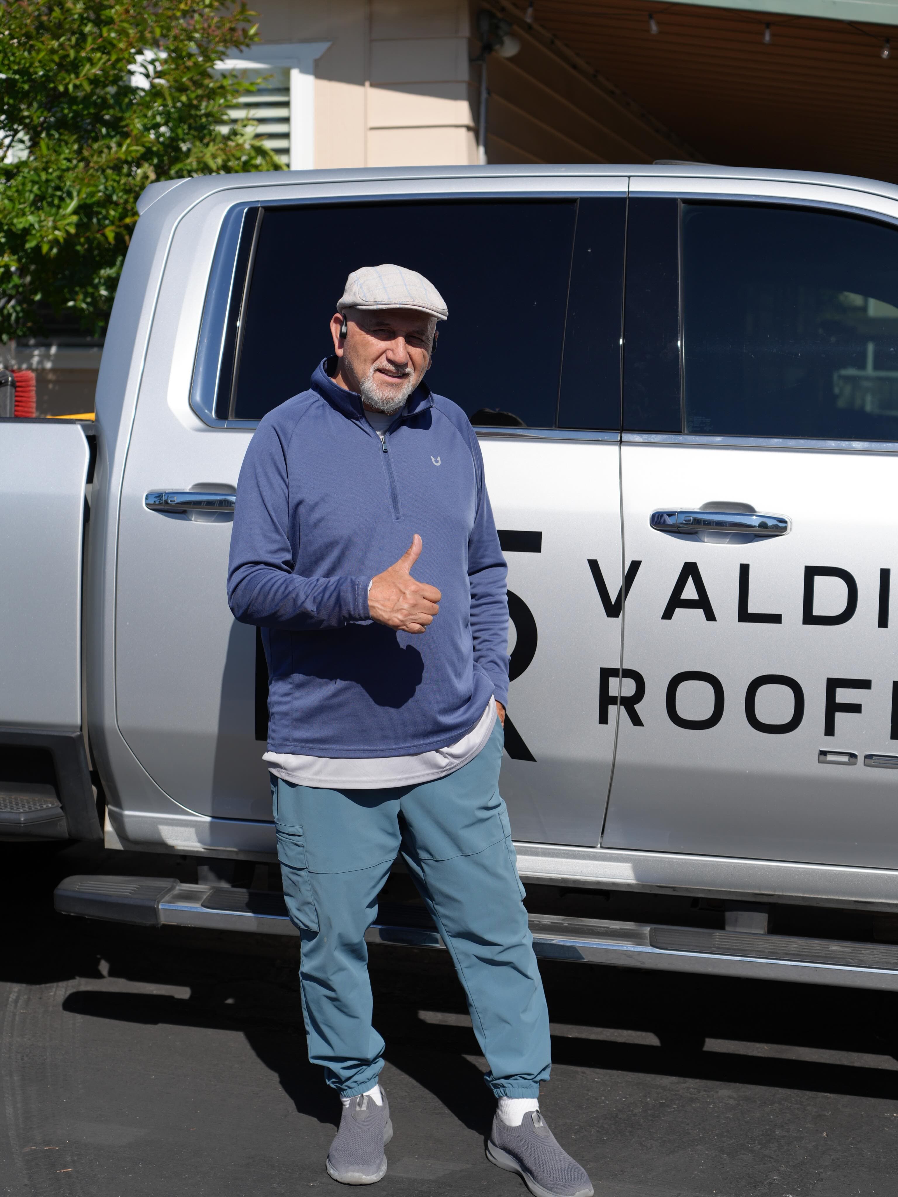 Valdivia Roofing owner by the company truck